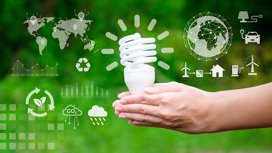 light bulb on green background , Ecological technology , Save earth concept