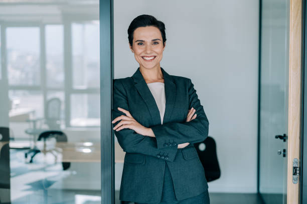istock Confident businesswoman in modern office. 1439235214