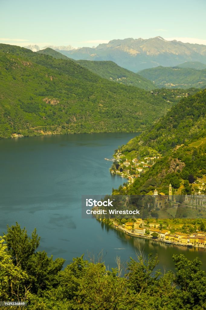 Aerial View over Morcote with Alpine Lake Lugano and Mountain Aerial View over Morcote with Alpine Lake Lugano and Mountain in a Sunny Day in Ticino, Switzerland. Mountain Stock Photo