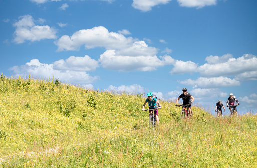 A small group of mountainbiker is riding a small path of a green meadow on a sunny summer day at Val Gardena in Italy.
Canon EOS 760D, 1/500, f/14, 62 mm.