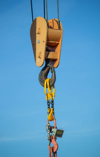 istock gantry crane with hook against blue sky 1439239478