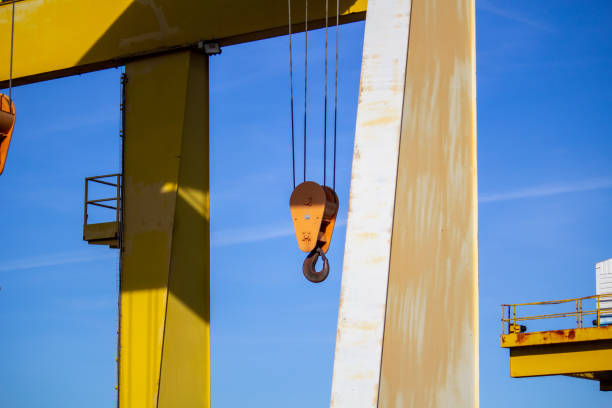 gantry crane with hook against blue sky