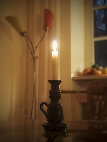 Candle on a glasstable