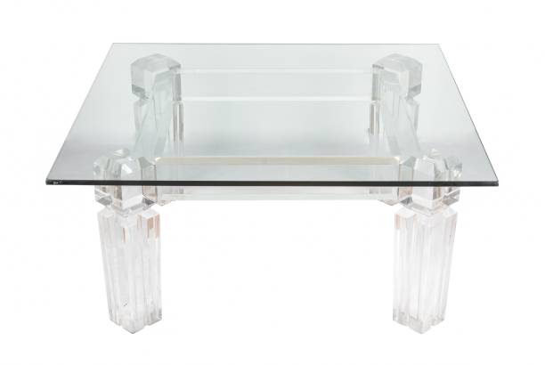 istock Modern glass table under the lights isolated on a white background 1439239859