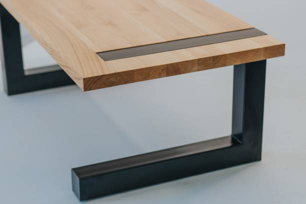 istock Table made of a wooden surface and black metal 1439240280