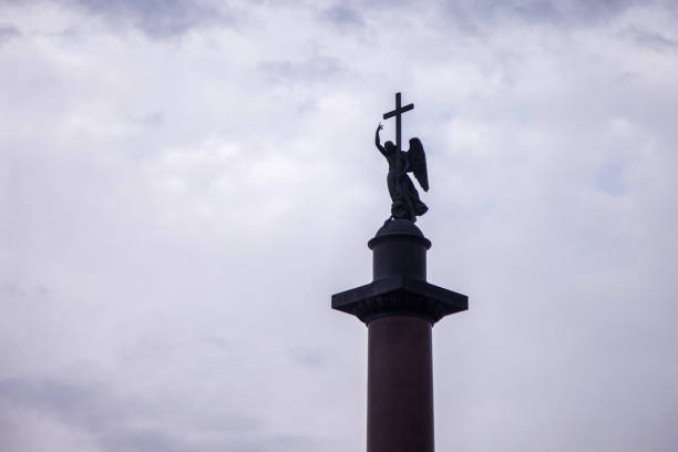istock Alexander column on Palace square at dark sky background, bottom view. Unique urban landscape center St Petersburg. Central historical sights city. Tourist places in Russia. Capital Russian Empire 1439240348
