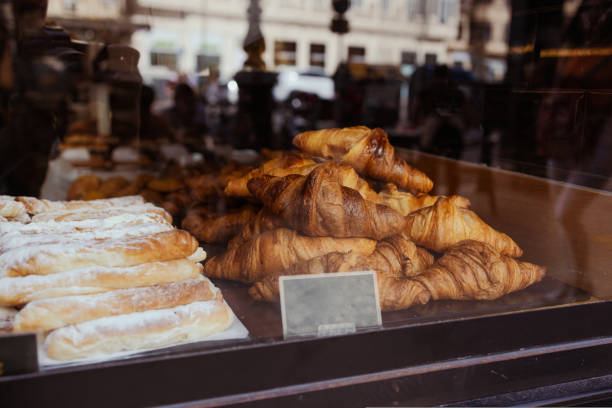 istock Modern bakery with different kinds of bread, cakes and buns.Warm croissants and rolls with fresh butter. French and American croissants and pastries are enjoyed all over the world. 1439241536