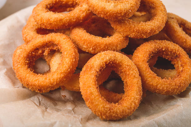 istock Fried onion rings, deep-fried, snack, no people, selective focus, 1439245912