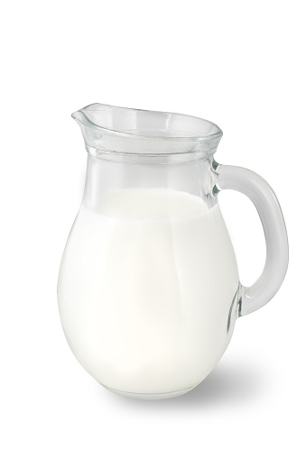 Glass jug of fresh milk isolated on white background. Milk food.