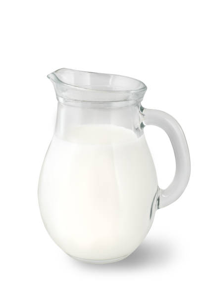 Glass jug of fresh milk isolated on white background. Glass jug of fresh milk isolated on white background. Milk food. jar of milk stock pictures, royalty-free photos & images