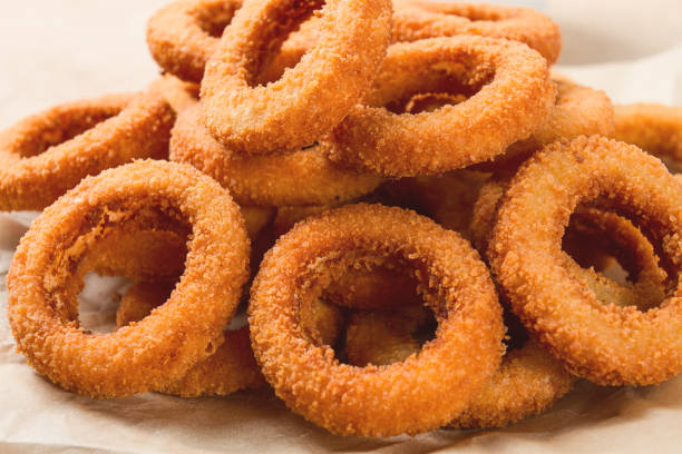 istock Fried onion rings, deep-fried, snack, no people, selective focus, 1439247905
