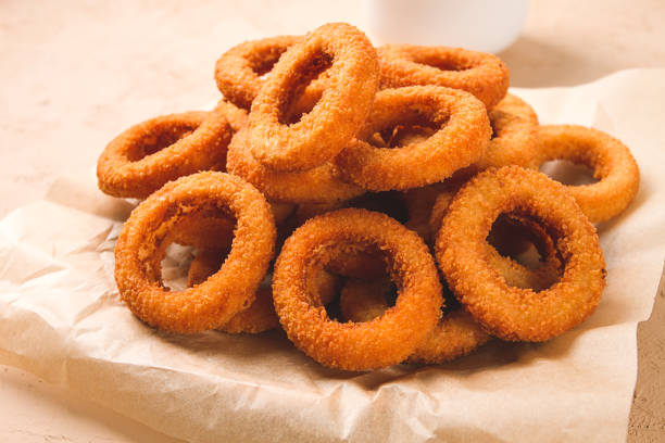 istock Fried onion rings, deep-fried, snack, no people, selective focus, 1439248120