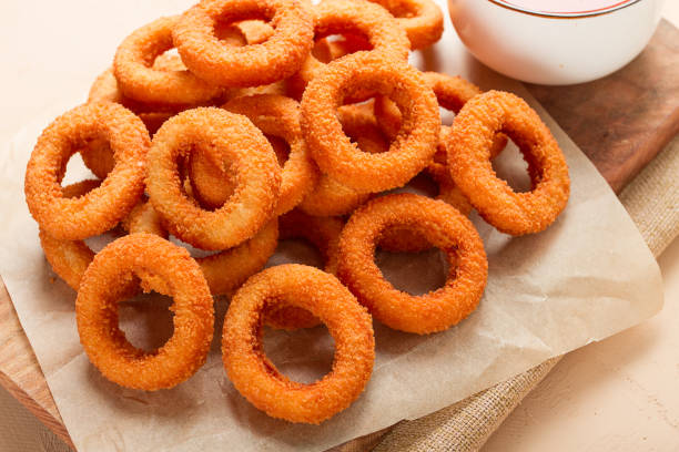istock Fried onion rings, deep-fried, snack, no people, selective focus, 1439248165