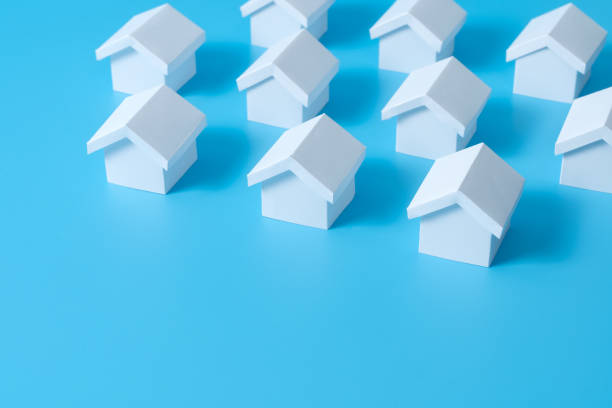 istock Real estate property concept using miniature white houses 1439250090