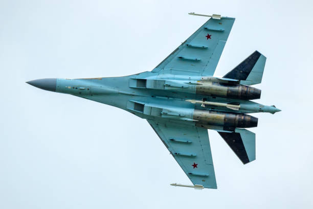 Russian Air Force plane Sukhoi Su-35 flies in sky, Russia stock photo