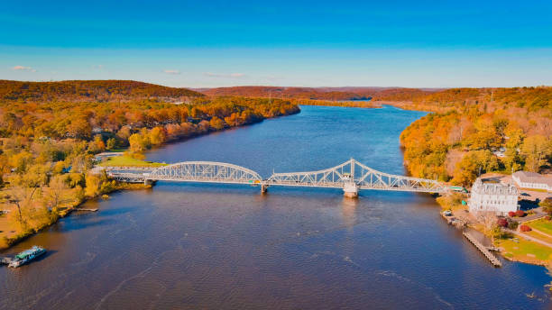 istock Autumn forest on the riverside, beautiful trees, blue river and bridge. Fall colors. View above. East haddam, Connecticut 1439250243