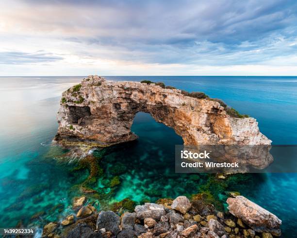 Es Pontas Natural Arch On The Northern Coast Of The Island Of Mallorca In Spain Stock Photo - Download Image Now