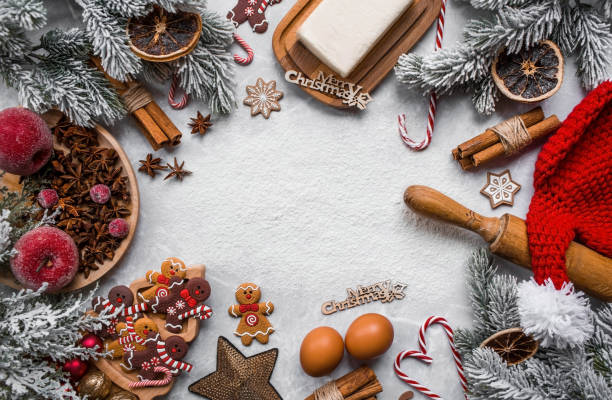 istock Happy New Year 2023. Banner with kitchen utensils, Christmas decorations, cinnamon, gingerbread and spruce on a marble background. A greeting card for Christmas. The concept of cafes and restaurants. 1439254022