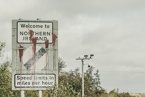 Killeen, Northern Ireland, UK - October 30, 2022: Roadside sign welcoming visitors travelling on the N1 from the Republic of Ireland and entering into Northern Ireland on the A1 near Newry (County Down).