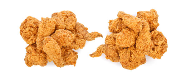 istock Heap of fried chicken isolated on white 1439255625