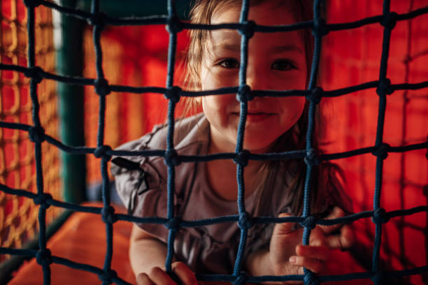 istock Little girl having fun on playground 1439256267