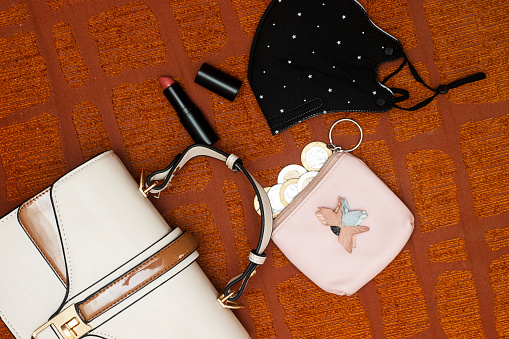 leather shoulder bag and medical mask, money wallet and lipstick