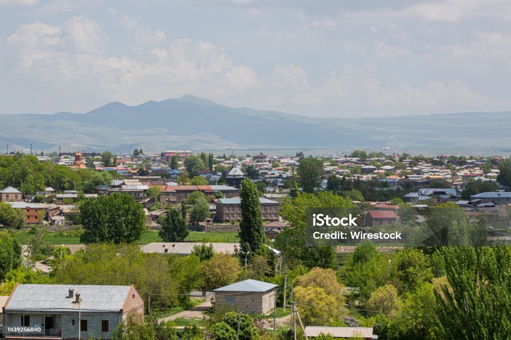 Beautiful skyline, trees, and nearby mountains in the historic city of Gyumri, Leninakan, Armenia The beautiful skyline, trees, and nearby mountains in the historic city of Gyumri, Leninakan, Armenia Aerial View Stock Photo