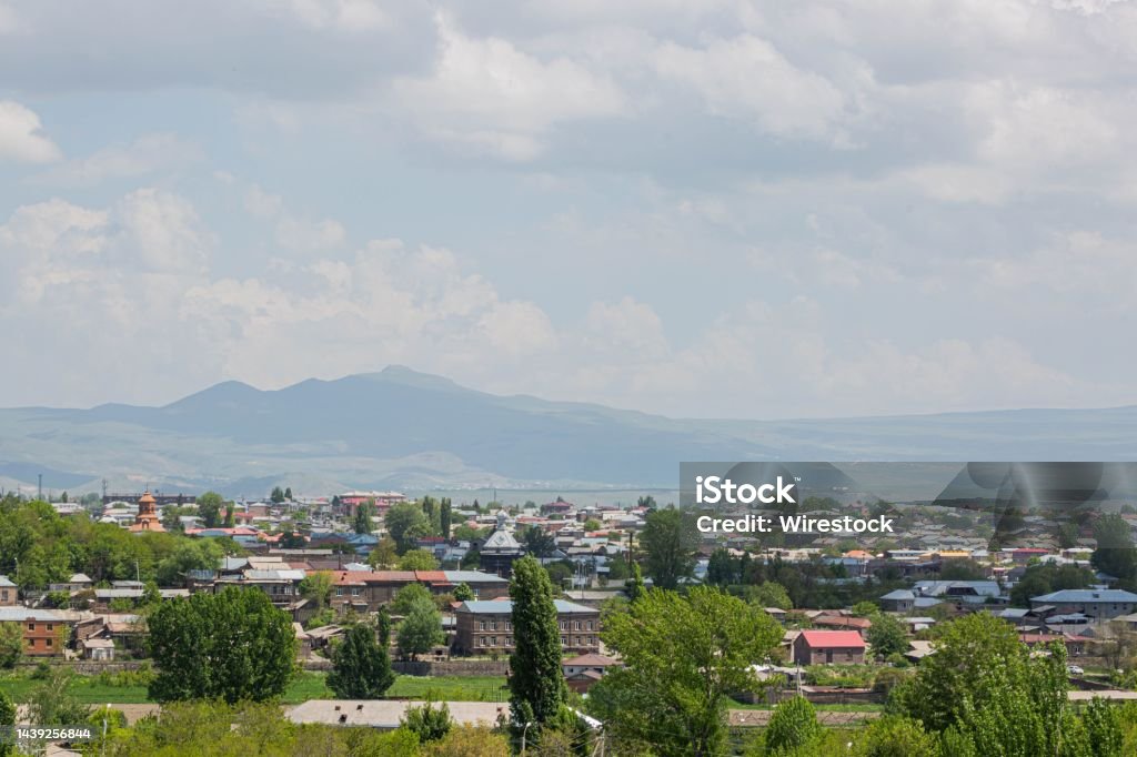 Beautiful skyline, trees, and nearby mountains in the historic city of Gyumri, Leninakan, Armenia The beautiful skyline, trees, and nearby mountains in the historic city of Gyumri, Leninakan, Armenia Aerial View Stock Photo