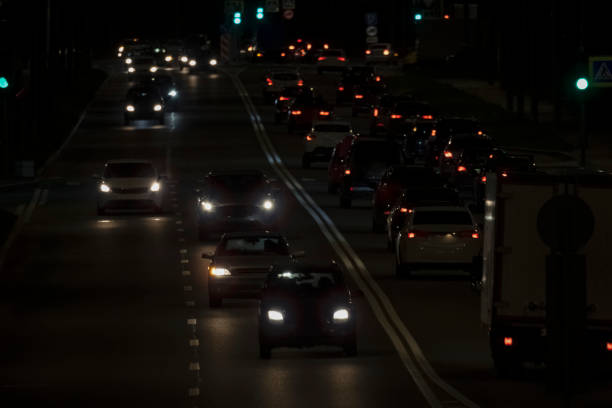 istock cars driving on the evening road 1439257921