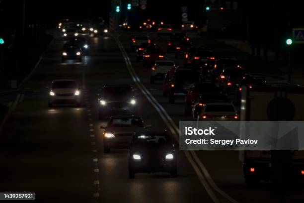 Cars Driving On The Evening Road Stock Photo - Download Image Now - Air Pollution, Asphalt, Back Lit