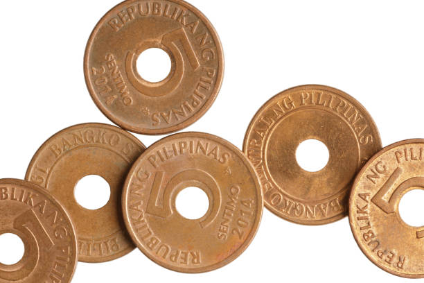 istock Close up of old 5 Sentimo Philippines coins isolated 1439258269
