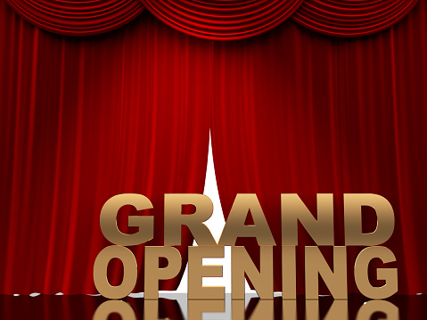 Grand opening label on red curtain background