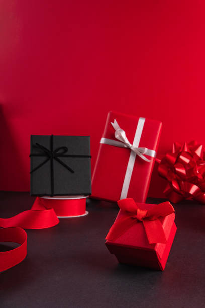Close up of three present boxes ready to give away, black and red. stock photo