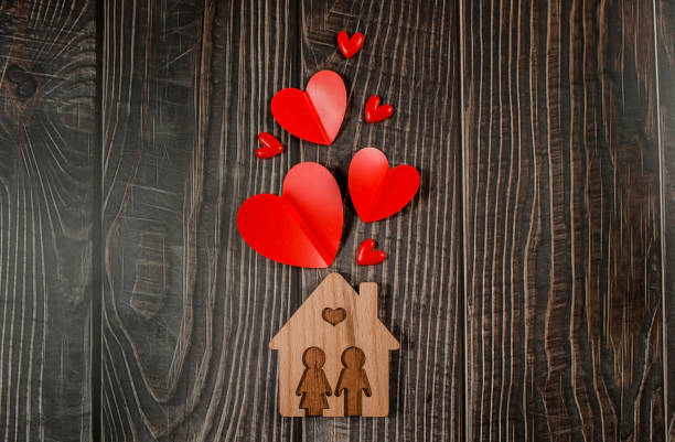 home symbol with red hearts on wooden background with copy space. home sweet home. - investment real estate construction residential structure imagens e fotografias de stock