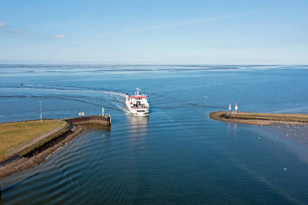 Aerial from the ferry from Schiermonnikoog arriving in the harbor from Lauwersoog in the Netherlands stock photo