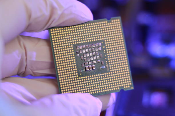 istock Computer hardware service concept. Desktop pc or laptop circuit board repair technician. person install processor chip into pcb socket 1439266226