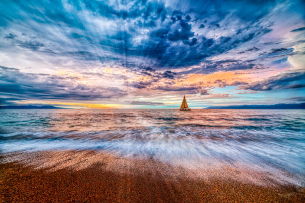 istock Sunset Boat Ocean Landscape Sailboat Inspirational Sun Rays 1439266264