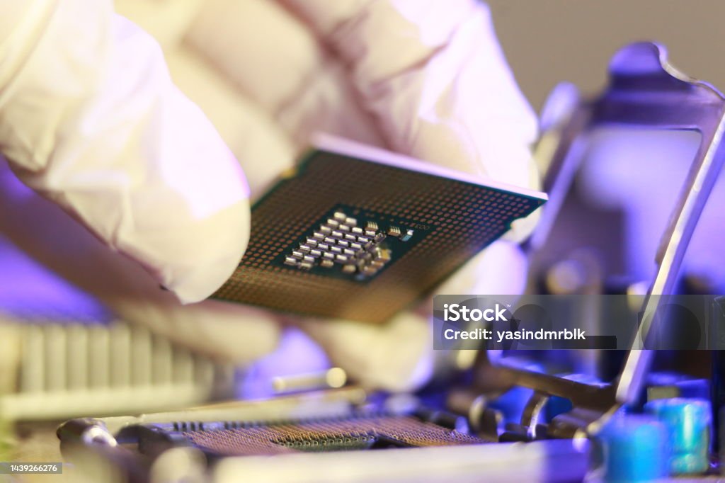 Microprocessor Socket. Shop Technician Installing Cpu Chip Microprocessor Socket On Motherboard ...