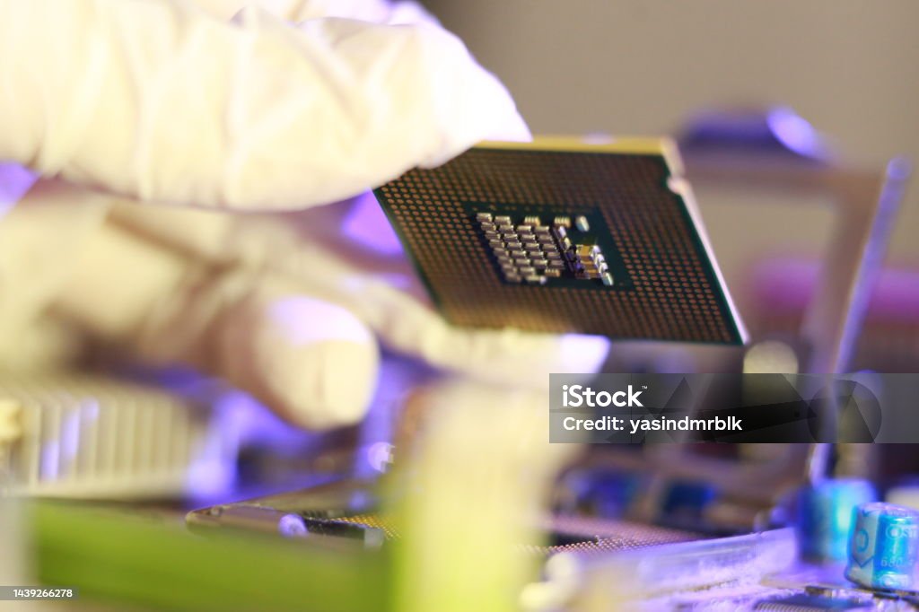Computer Chip Installation Technician Installing Cpu Chip Microprocessor Socket On Motherboard ...