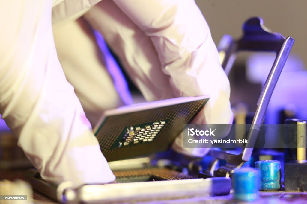 Computer Chip Installation Technician Installing Cpu Chip Microprocessor Socket On Motherboard ...