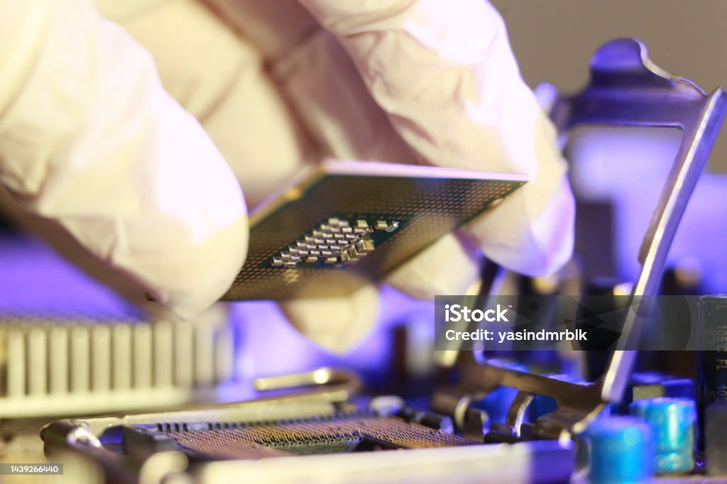Computer Chip Installation Technician Installing Cpu Chip Microprocessor Socket On Motherboard ...