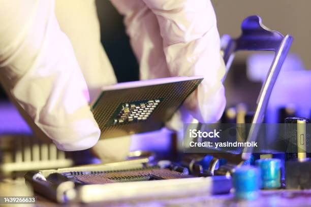 Computer Chip Installation Technician Installing Cpu Chip Microprocessor Socket On Motherboard ...