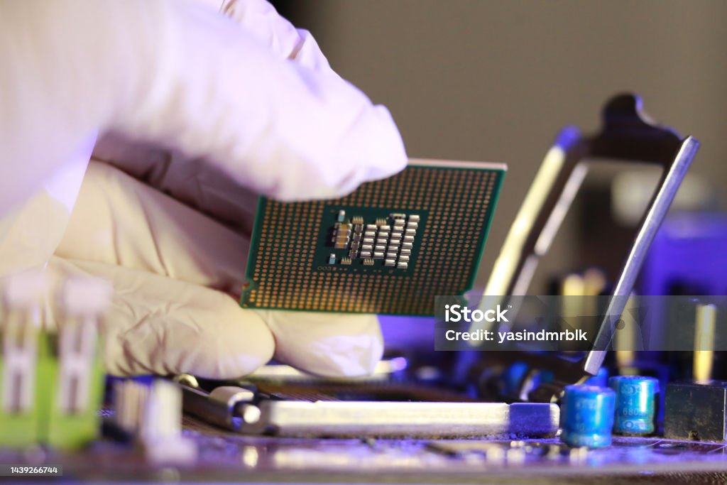 Computer Chip Installation Technician Installing Cpu Chip Microprocessor Socket On Motherboard ...