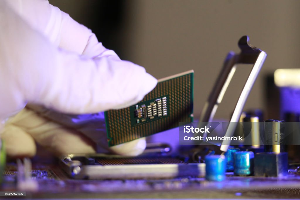 Microprocessor Socket. Shop Technician Installing Cpu Chip Microprocessor Socket On Motherboard ...