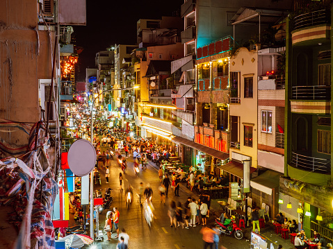 Night shot of the famous street Bui Vien in Ho Chi Minh with many tourists and bars