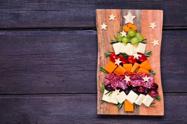 istock Christmas tree charcuterie board over a dark wood background 1439267817