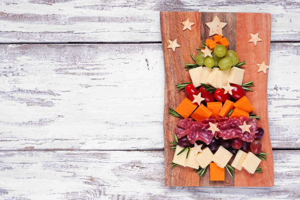 istock Christmas tree charcuterie board over a white wood background 1439267821