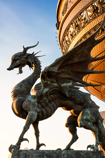 Kazan - June 18, 2021: Statues of Dragon Zilant at Wedding palace (Family center) in Kazan, Tatarstan, Russia. Vertical view of fantasy animal, symbol of Kazan city. Sightseeing and monument theme.
