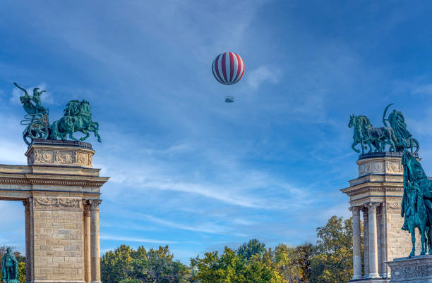bunch of colorful balloons with a large foil ball in the shape of a unicorn