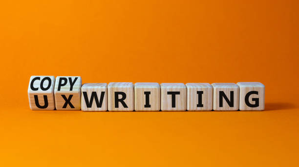 Copywriting or UX writing symbol. Turned cubes and changed concept words copywriting to UX writing. Beautiful orange background copy space. Business copywriting or UX writing user experience concept.